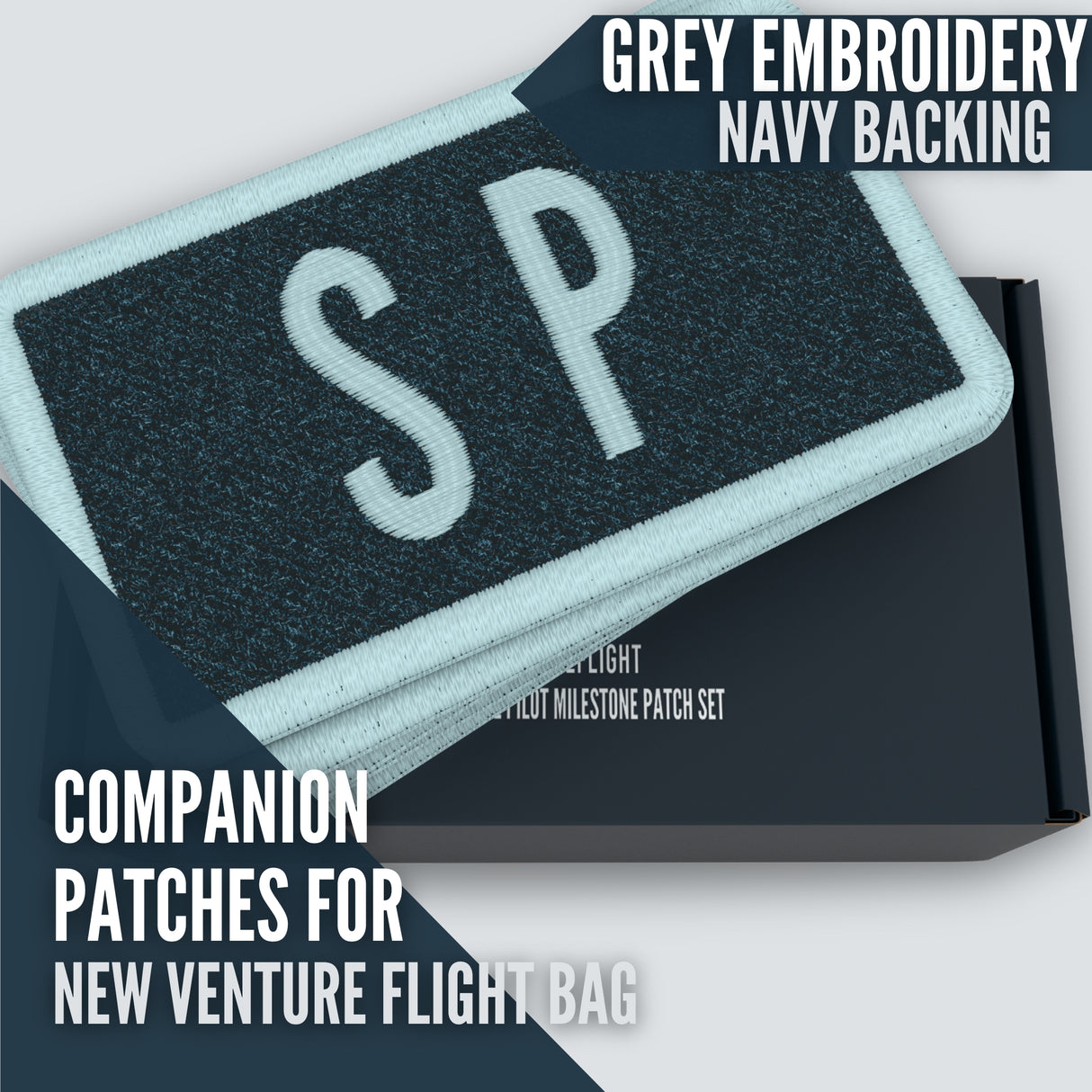 Grey embroidery thread on navy background.